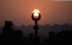 The sun rises over a mosque in Cairo on the first day of Eid al-Adha, November 27, 2009.